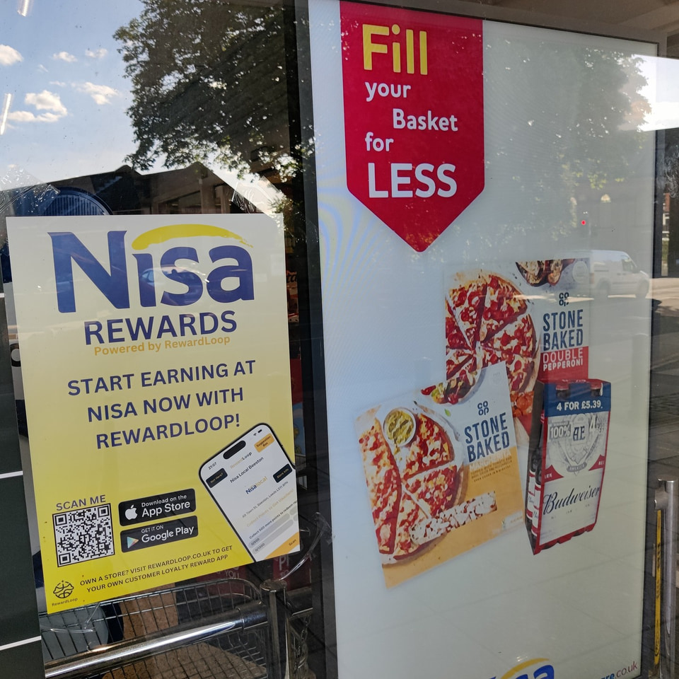 RewardLoop poster displayed in a Nisa Local store window